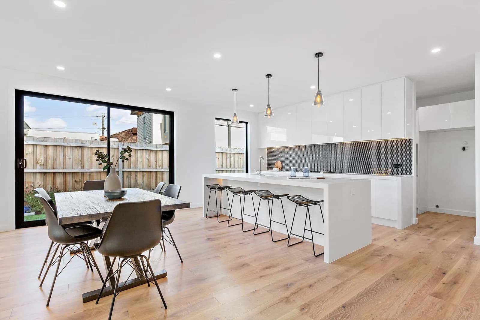 Open-plan kitchen and dining renovation with island bench by Nicon Built