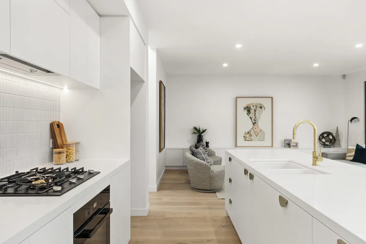 White galley kitchen renovation — Elwood, completed by Nicon Built