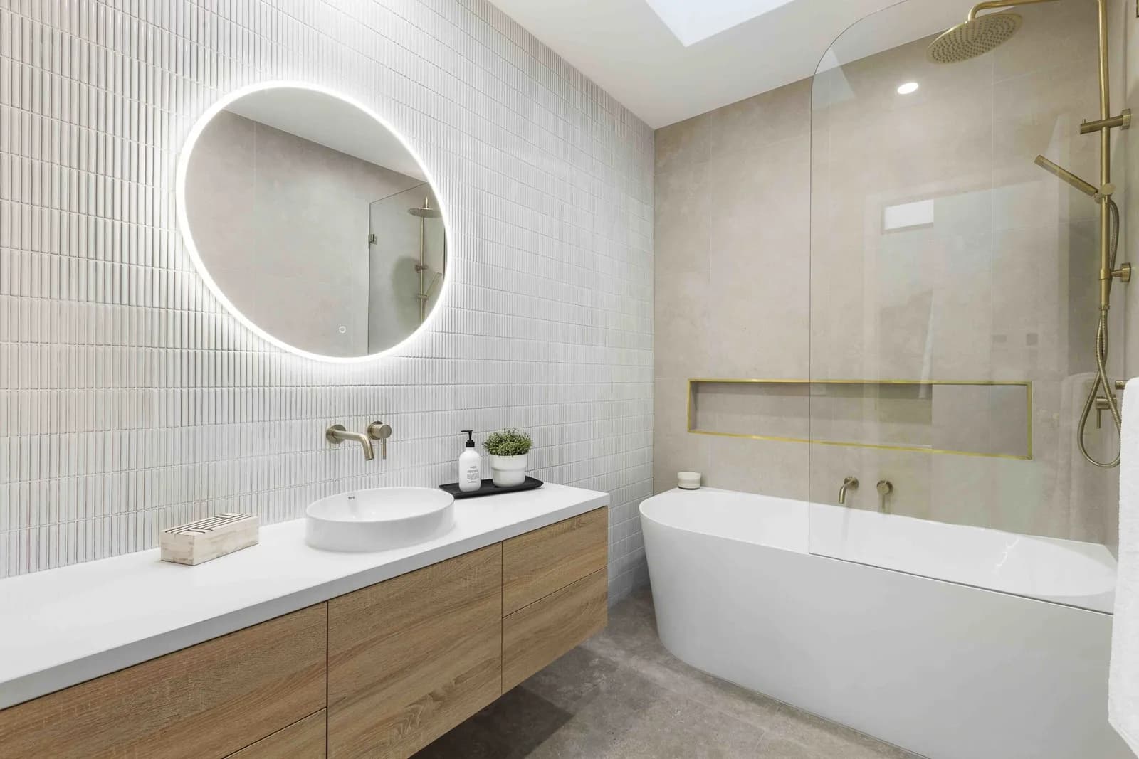 Modern ensuite bathroom addition with gold tapware by Nicon Built