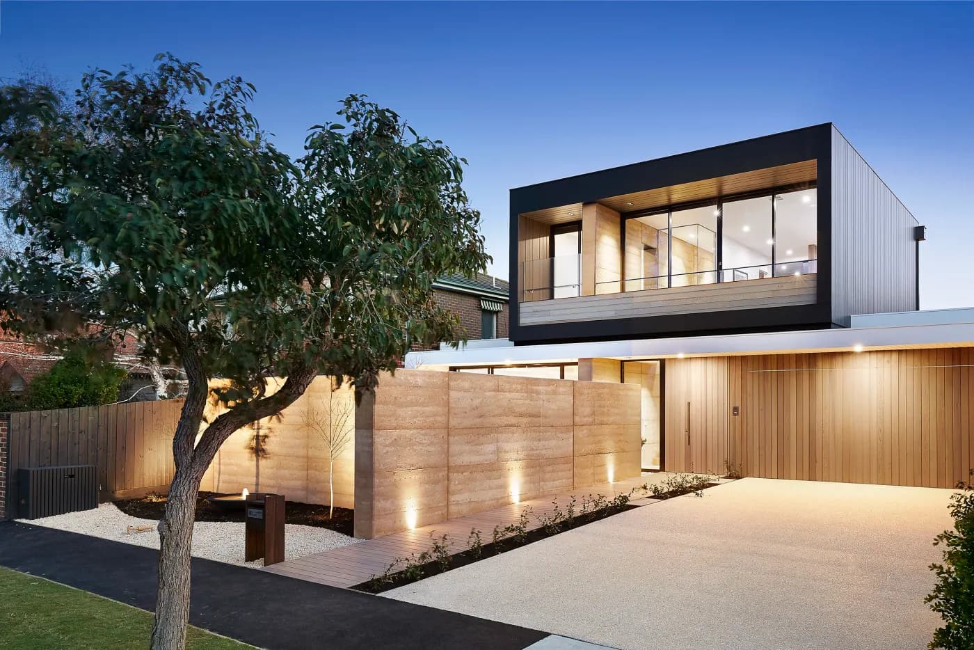 Architectural home with rammed earth and timber — Nicon Built