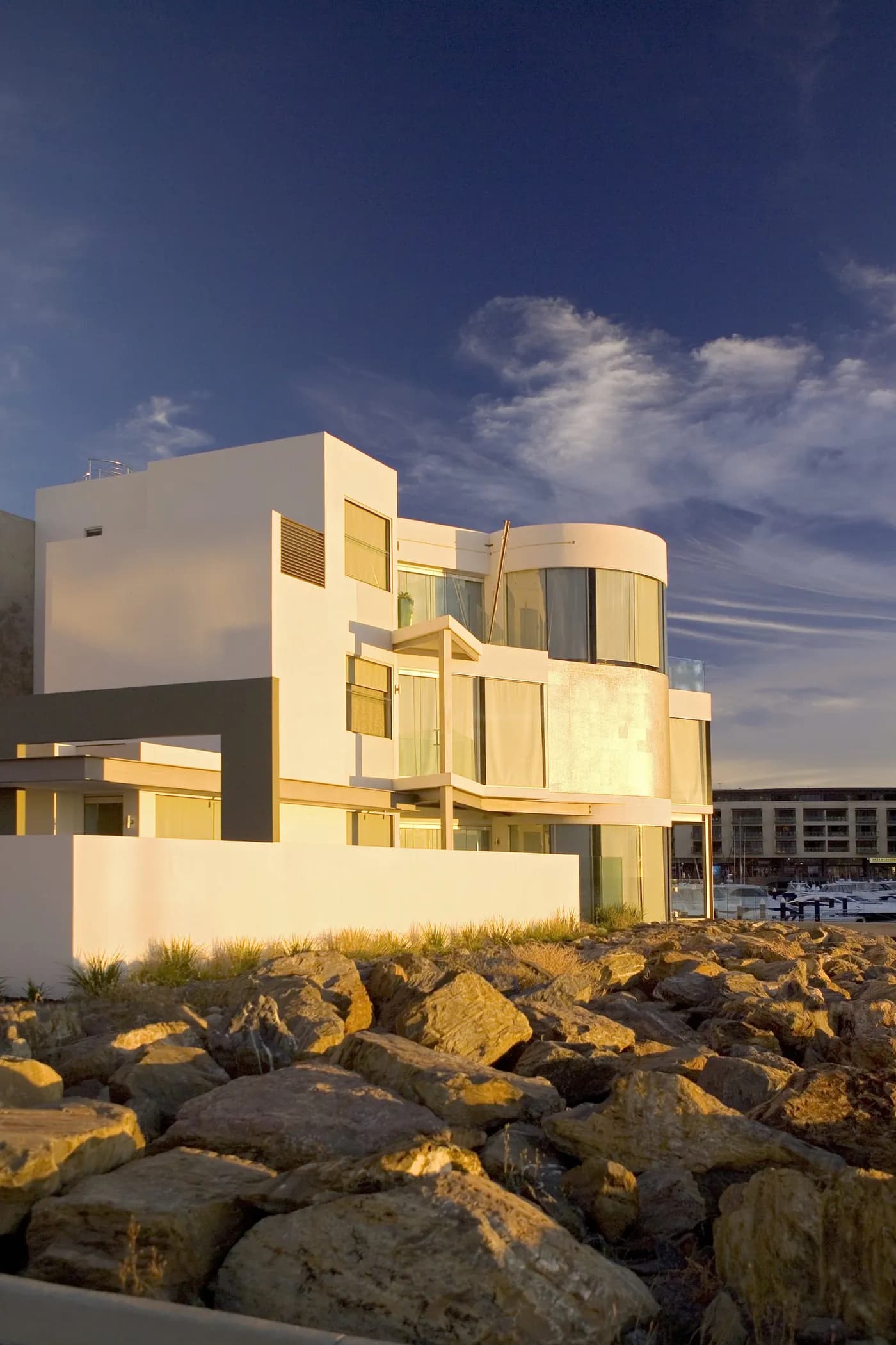 Architectural waterfront home at golden hour — Nicon Built